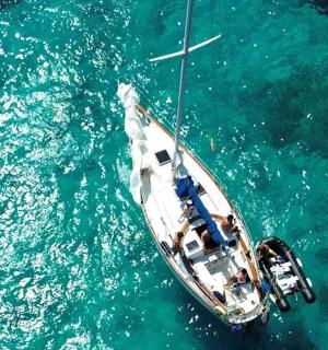 a boat floating in the water in the ocean