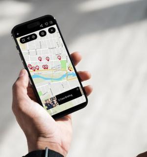 a person holding a cell phone in their hand