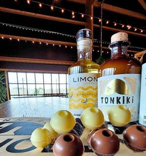 two bottles of whiskey and eggs on a table