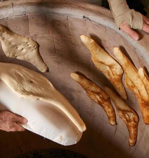 a person holding aached whale and a group of fries