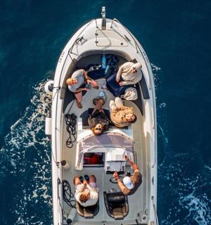 a group of people on a boat in the water