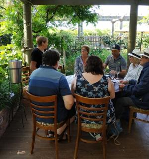 a group of people sitting around a table