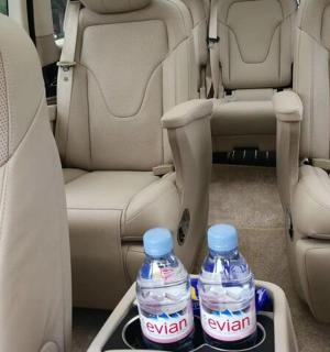 two bottles of water in the back seat of a car