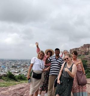 a group of people standing on top of a mountain