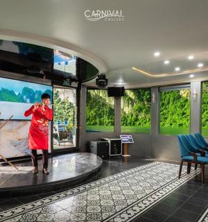 a woman standing on a stage in front of a screen