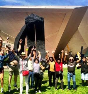 a group of people standing in front of a building