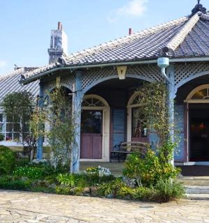 an old house with a porch and a door