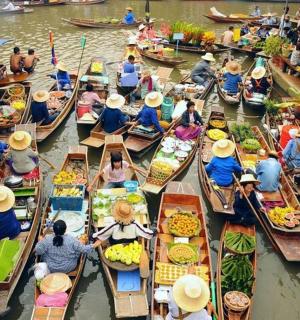 a group of people in boats in a market