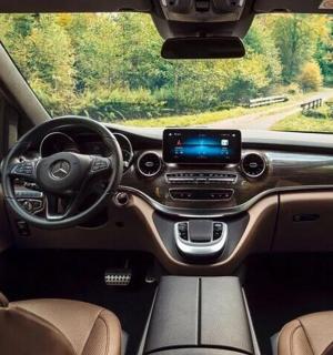 a view of the inside of a car with the dashboard