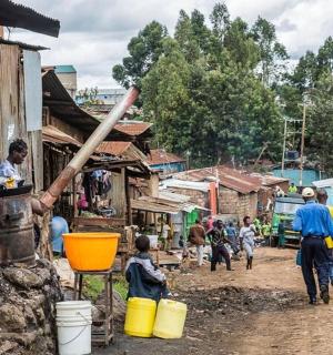 a group of people standing in a village