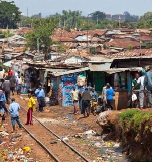 a group of people standing around in a village