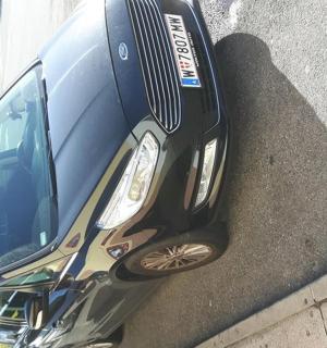 a car parked on the side of a building