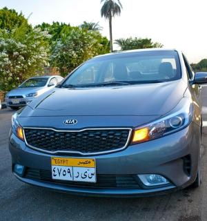 a silver car parked in a parking lot