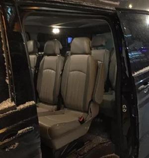 an open back seat of a van in the snow