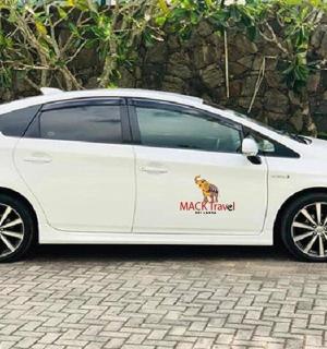 a white car with a sticker on the side of it