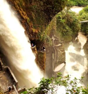 an aerial view of a waterfall on a river