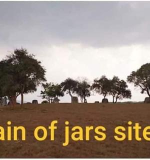 a sign that says pain of jars site in a field with trees