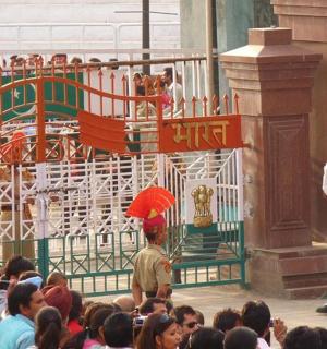 a group of people watching a performance in front of a crowd