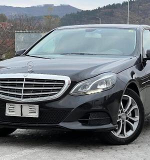 a black car parked in a parking lot