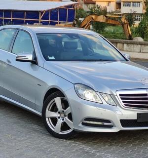 a silver car parked on the side of a road