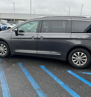 a silver van parked in a parking lot