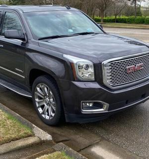 a black truck parked in a parking lot