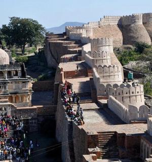 a group of people standing on the side of a building