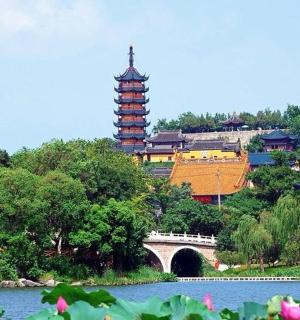 a pagoda and a bridge over a body of water