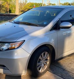 a silver car parked in a parking lot