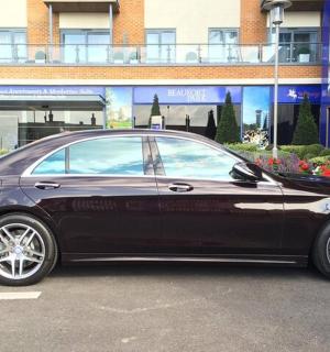 a black car parked in a parking lot