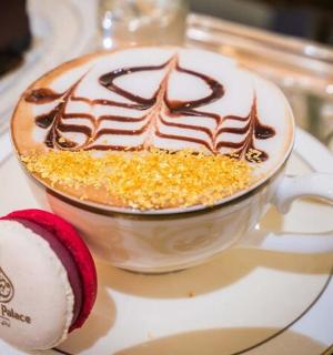 a cup of coffee on a plate on a table