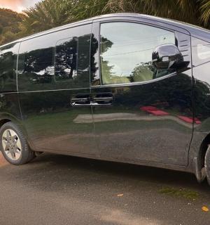 a black van parked on the side of a road
