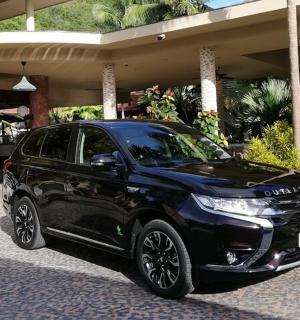 a black car parked in front of a building