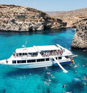 a group of people on a boat in the water