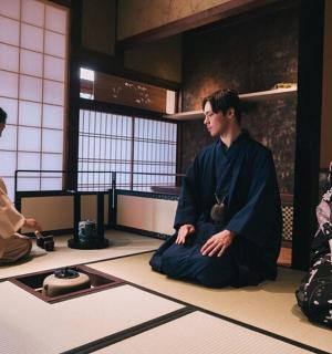 three people sitting on the floor in a room