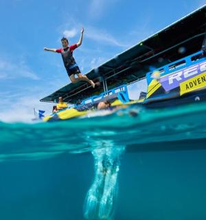 a man standing on a boat in the water