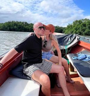 a man and a woman sitting on a boat