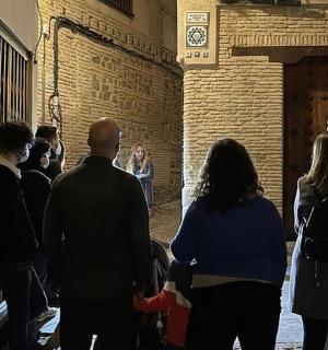 a group of people standing in an alley