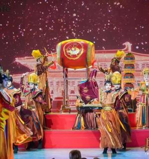 a group of people in costumes on a stage