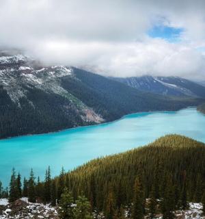 a view of a blue lake in the mountains