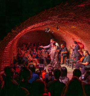 a woman standing on a stage in front of a crowd