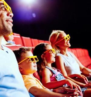 a group of people sitting in the audience wearing sunglasses