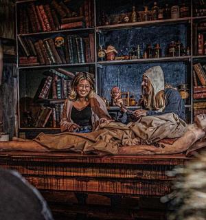 a man looking at a painting in a room with a painting of aorationerror