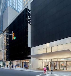 a building on a city street with a green traffic light