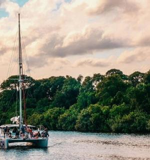 a boat with people on it in the water
