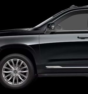 a black suv parked on a black background