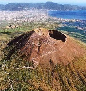 an aerial view of a mountain with the ocean