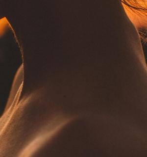 a close up of a person wearing a white shirt