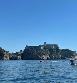 a boat in the water in front of a castle