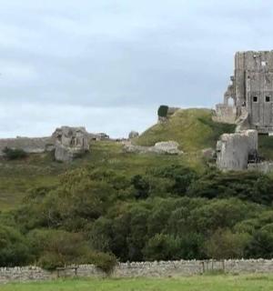 an old castle on top of a hill